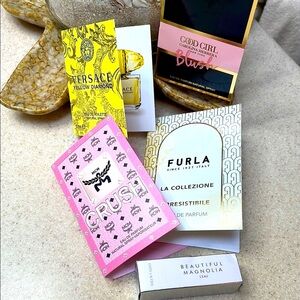 Versace, Carolina Herrera, MCM, Furls, Estée Lauder samples